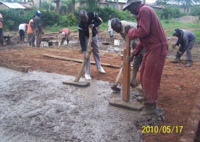 John with the workers laying the slab